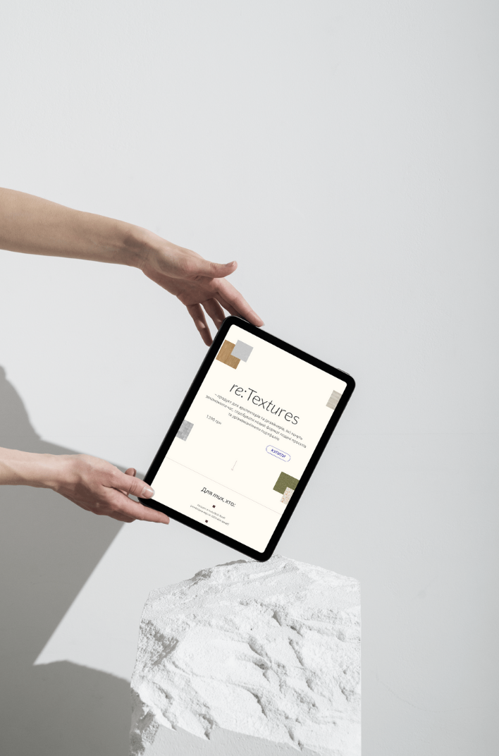 Graphic of a typography specimen showing the alphabet and numerals on top of a dark gray background.